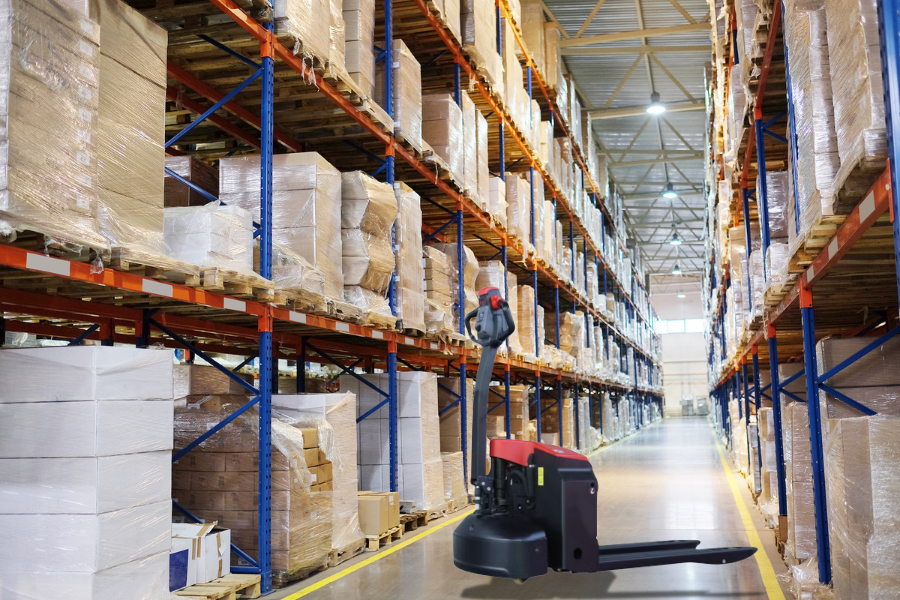Electric pallet jack and powered pallet truck operating in a Canadian warehouse with Raelon branding