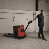 Raelon EPT25-WA electric pallet jack used for pallet handling in a loading area
